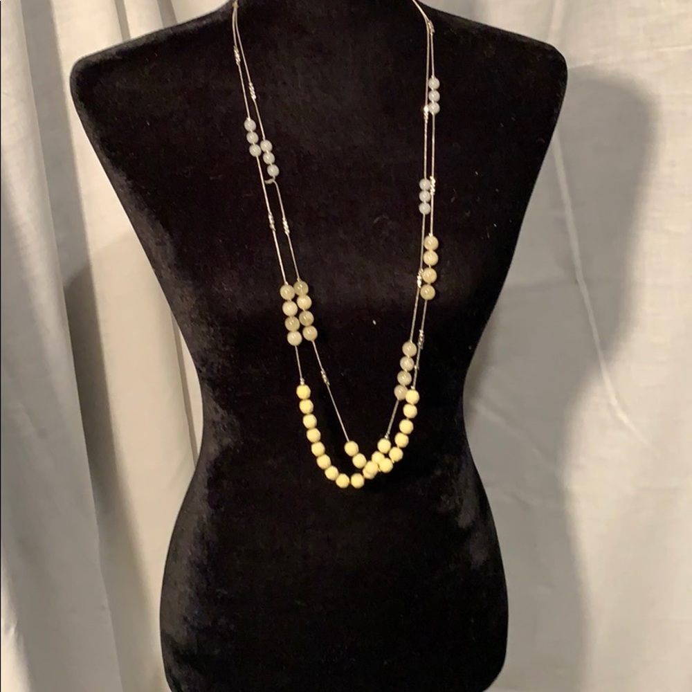 Long yellow-bead and silver necklace.